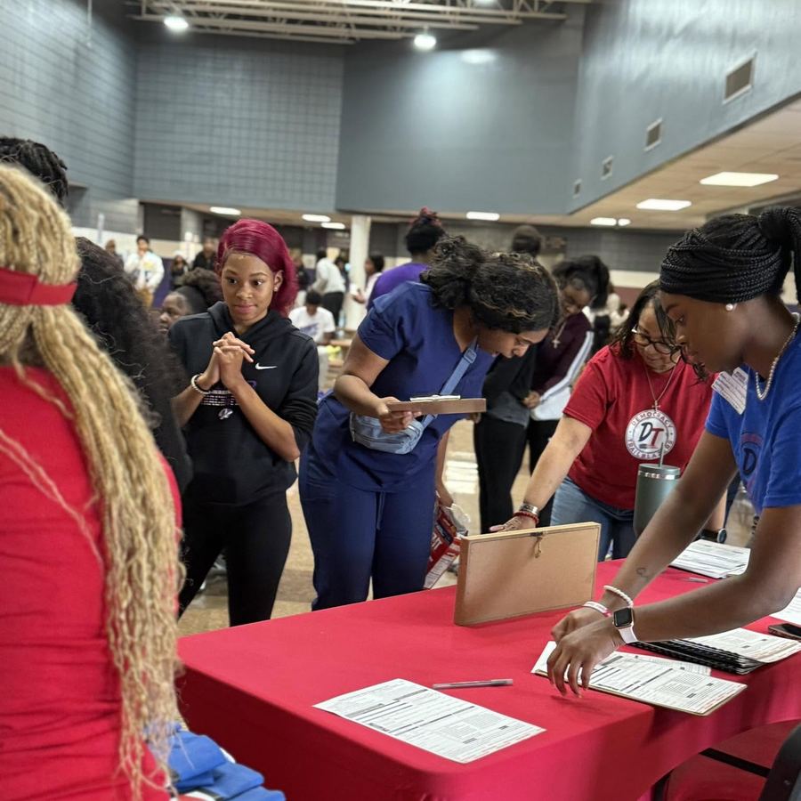 Students signing up at a Democracy Trailblazers table